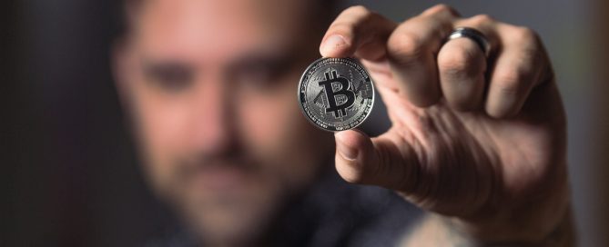man holding crypto currency