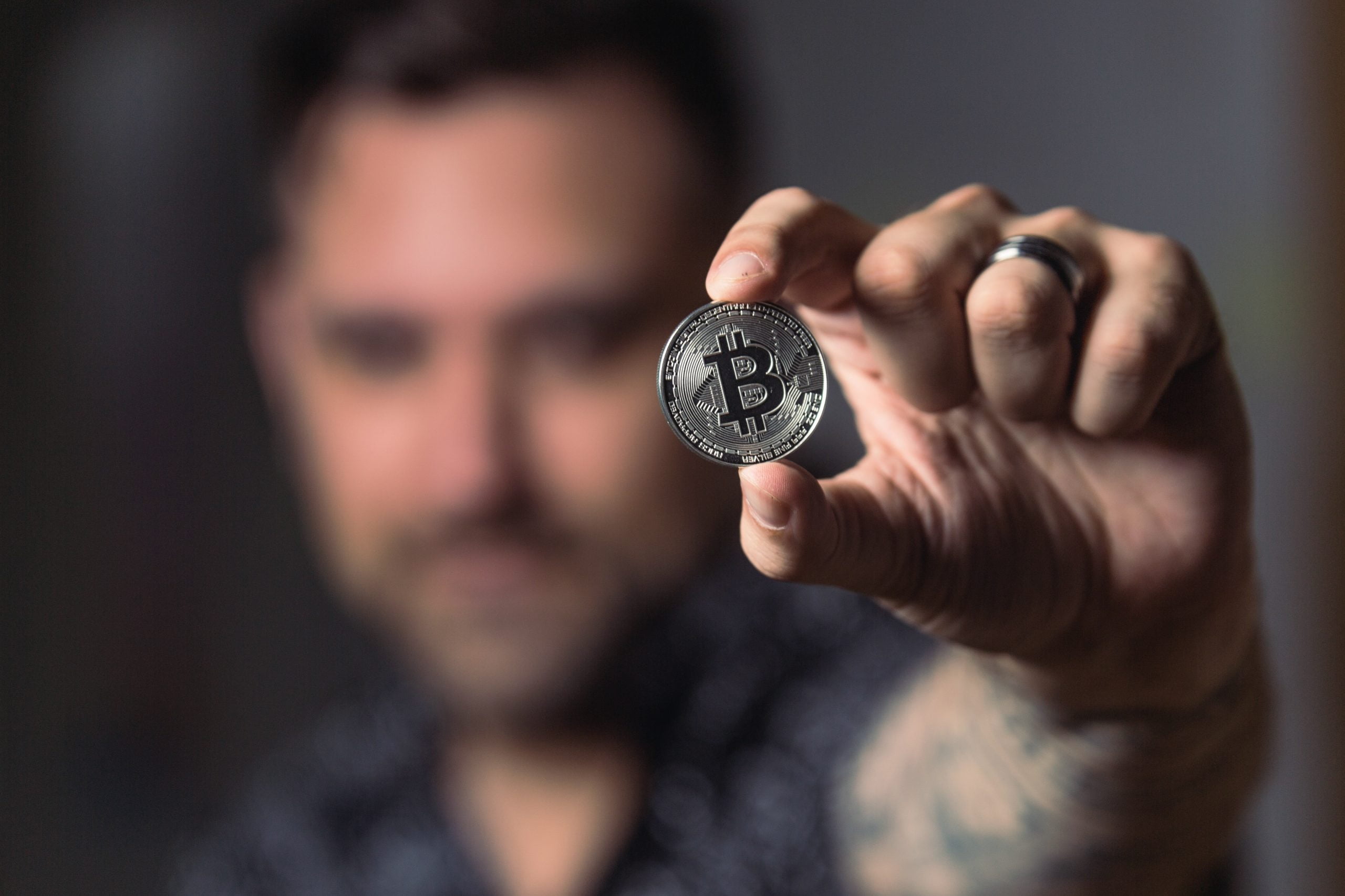man holding crypto currency