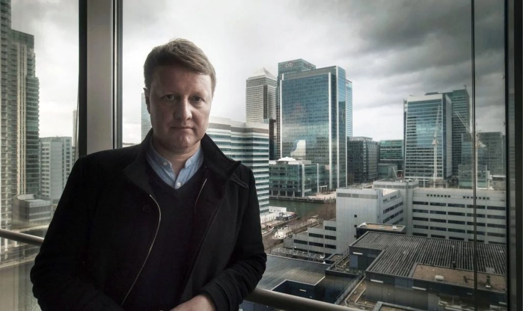 Andy Verity Business Speaker UK presenting economics insights